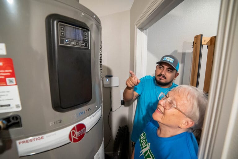 An Intown Plumbing technician checking the control panel of a water heater keeps turning off in a Rockwall TX home.