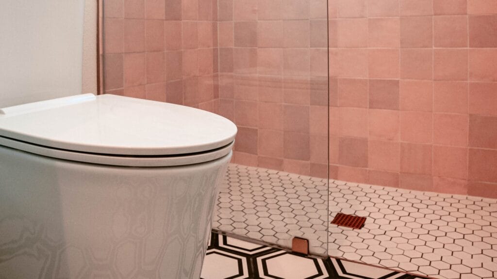 Modern bathroom with a clean, flowing shower drain, illustrating how to unclog a shower drain.
